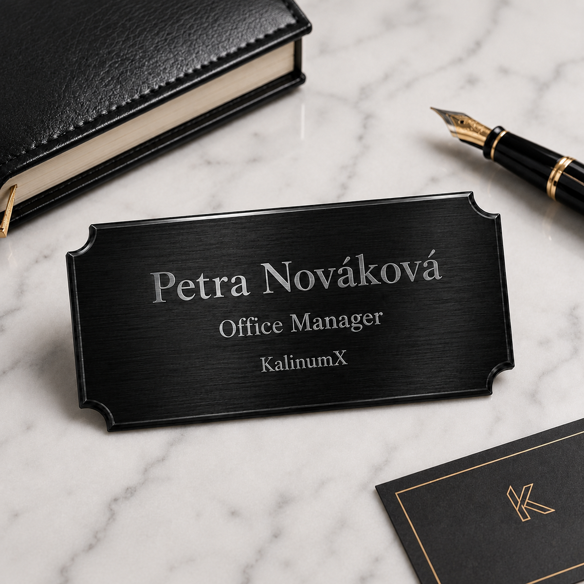 Metal nameplate, 76 × 25.4 × 0.5 mm, black, with engraving