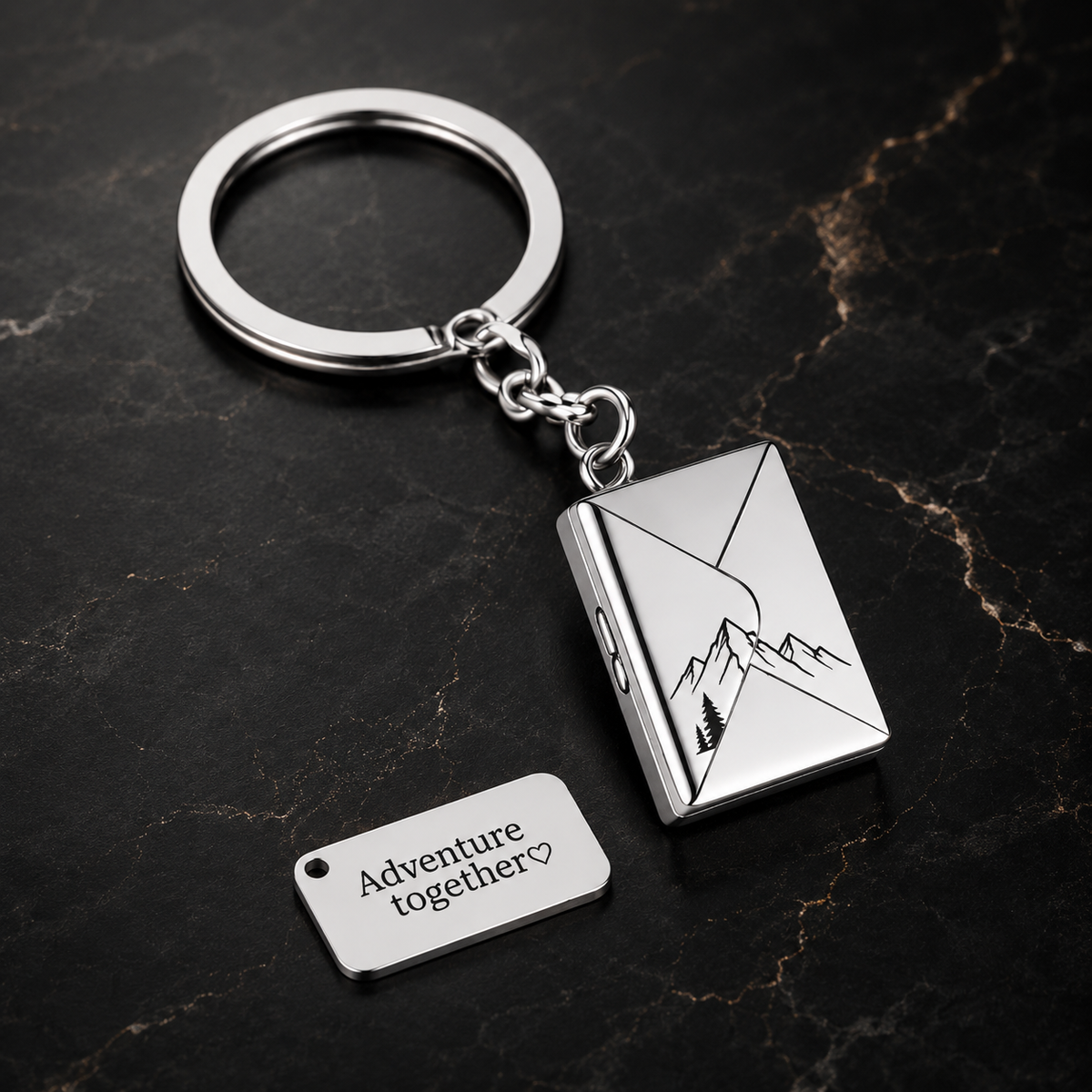 Klíčenka z nerezu – psaníčko 20 × 14 × 4 mm, s gravírováním