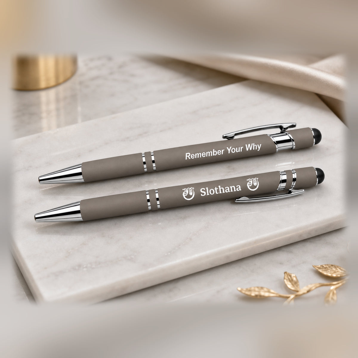 Two Slothana metal stylus pens – 143 mm – orange – engraving on both sides