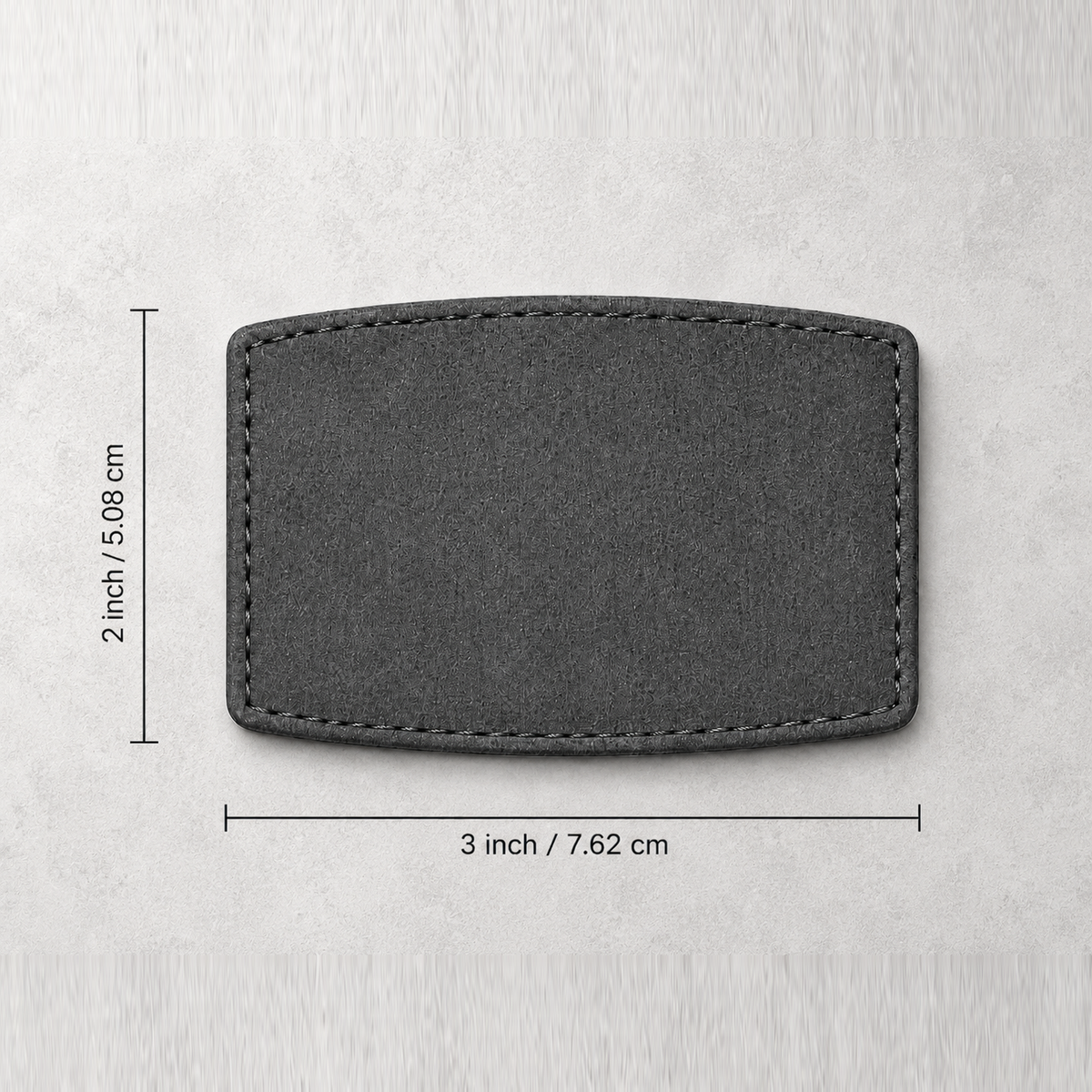 Nažehlovací šedá PU záplata – zaoblený obdélník 76,2 × 50,8 mm